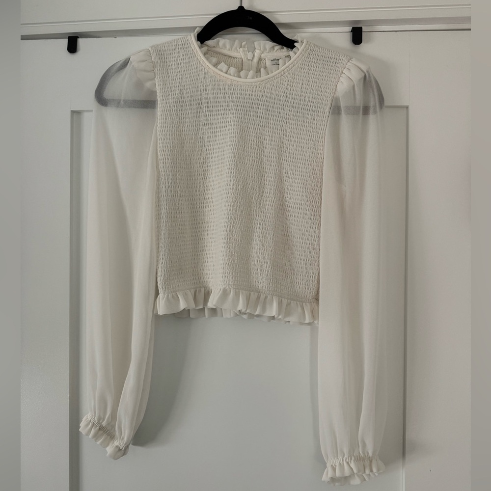 Cream smocked top with sheer sleeves